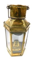An early 20thC brass ship's storm lantern, by Eli Griffiths and Sons 1910, with burner and key, 40.5