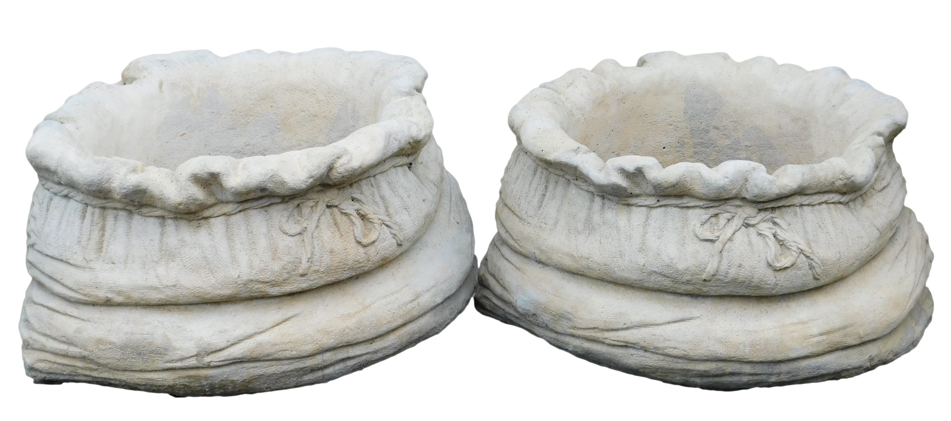 A pair of concrete planters, of compressed tied bag form, 39cm wide