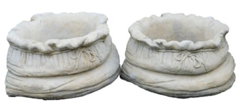 A pair of concrete planters, of compressed tied bag form, 39cm wide