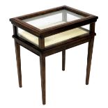 A small mahogany bijouterie display table, with a rectangular glazed hinged top, glazed sides, on sq
