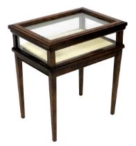 A small mahogany bijouterie display table, with a rectangular glazed hinged top, glazed sides, on sq