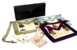 Three Victorian Masonic aprons, one with silver adornments, in a leather case, named to Broe J Wicke