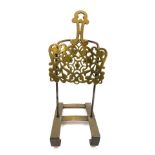 A 19thC brass and cast iron sliding trivet stand, with pierced foliate decoration, 42cm wide.