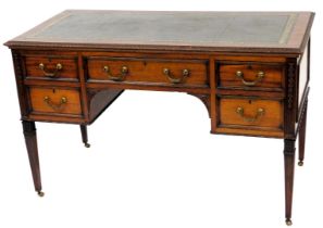 A late 19th/early 20thC mahogany desk in a French style, the rectangular top with a green and gilt l