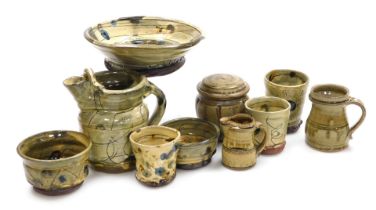 A group of late 20thC studio pottery, including a water jug, bowls, jar and cover, and a vase. (qty)