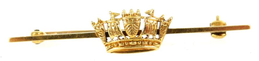 A naval crown bar brooch, stamped 14ct, in a box for the Goldsmiths and Silversmiths Company Ltd, 11