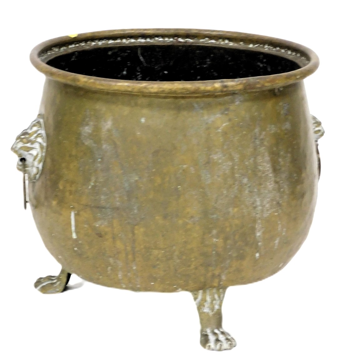 A late 19thC brass log bucket, with twin lions head and ring handles, raised on three paw feet, 35.5