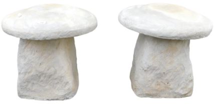 A pair of concrete staddle stones, 45cm wide.