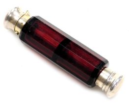 A Victorian cranberry glass double ended scent bottle, with a button operated hinged lid and a screw