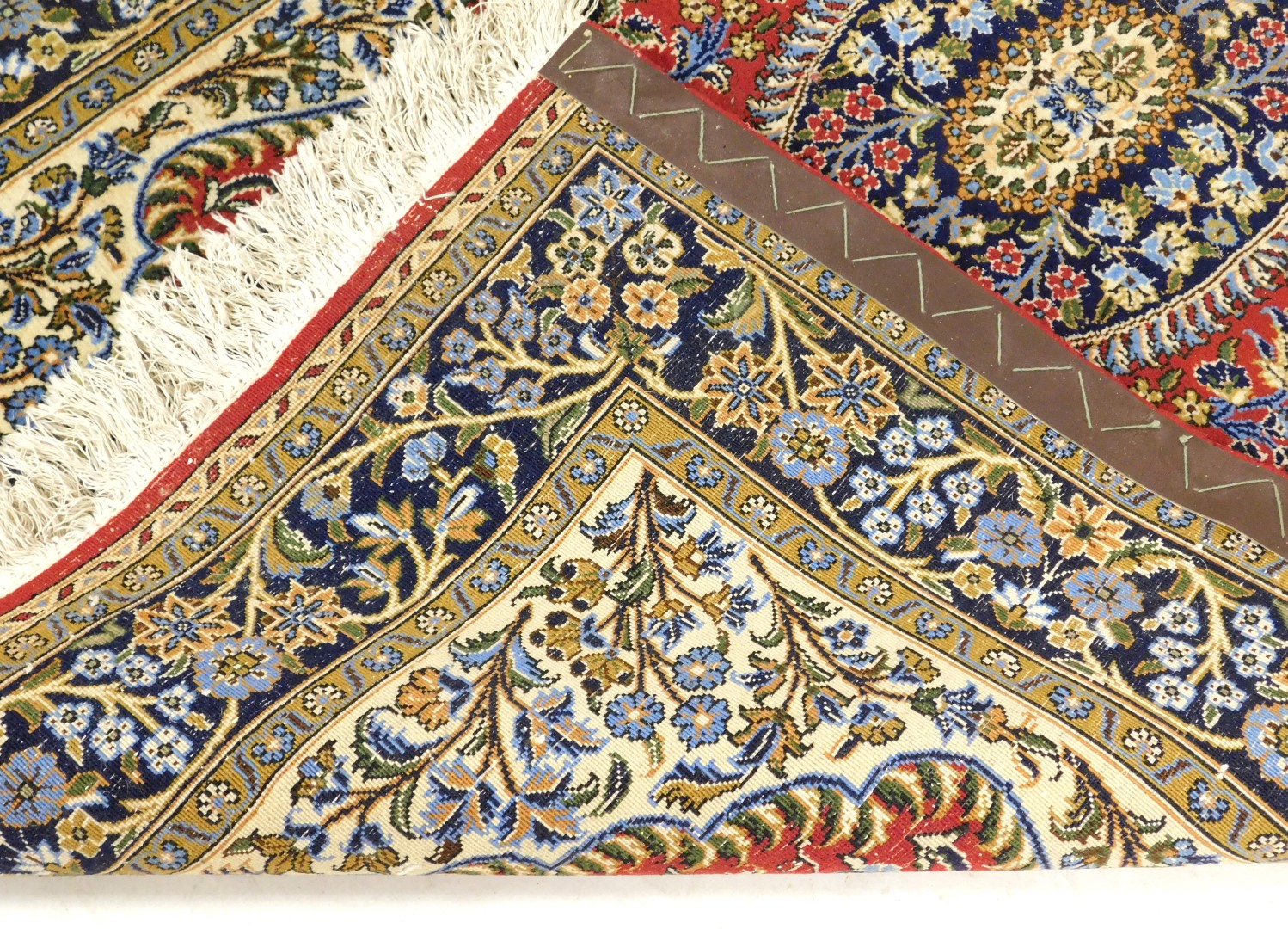 A Persian style rug, decorated with flowers and leaves, on a red ground within a cartouche, with cre - Image 3 of 3