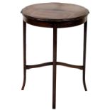 An Edwardian mahogany occasional table, circular top with moulded edge, on plain supports, with spla