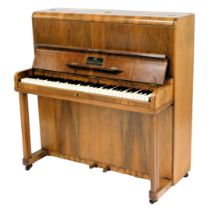 A small walnut upright piano, label for Cestrian model, Herbert Ellis, Chester, with simulated ivory