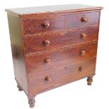 An early Victorian chest of drawers, the rectangular top with a moulded edge, above two short and th