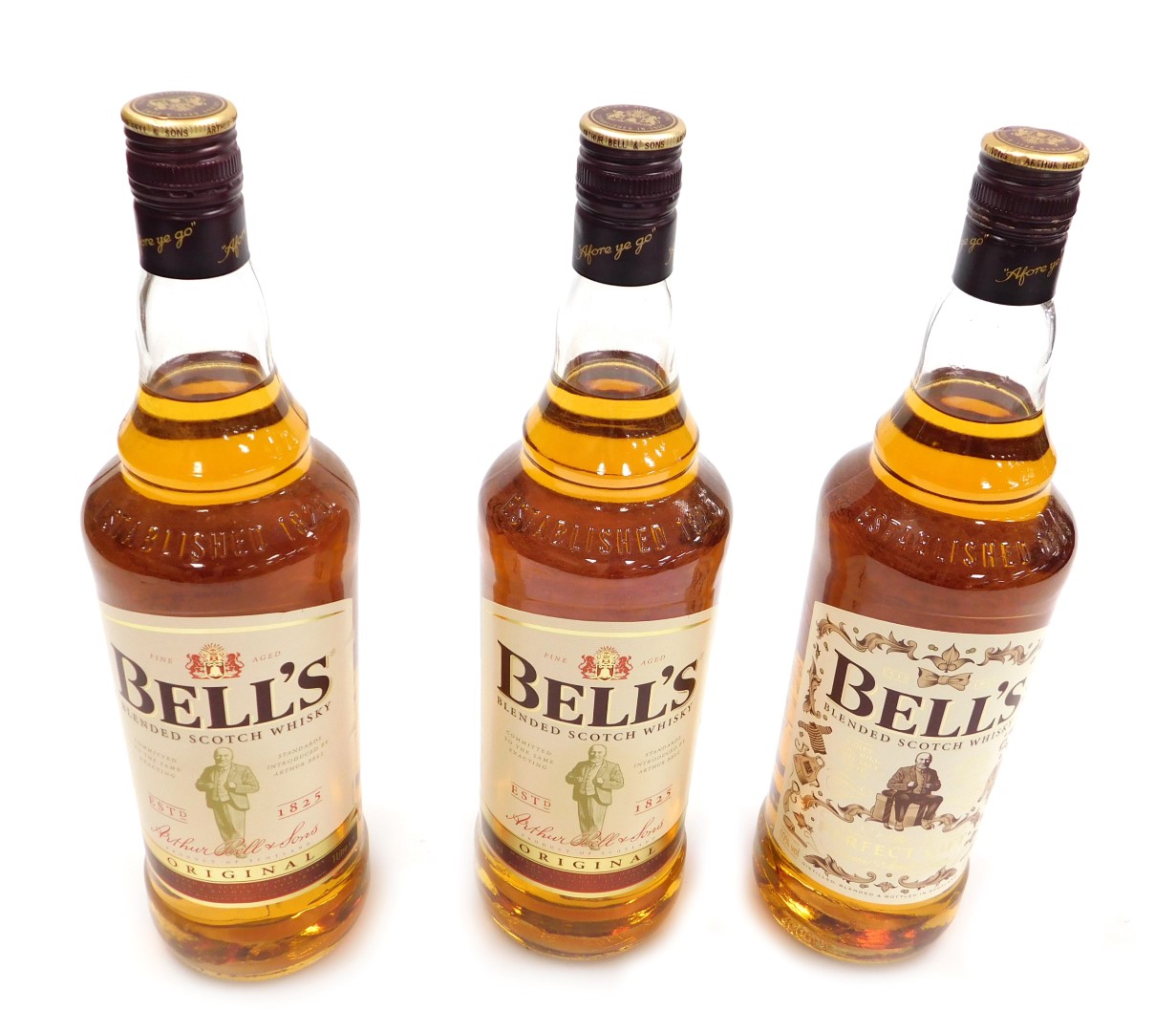 Three bottles of Bell's blended scotch whisky, fine aged, including a bottle with a limited edition