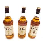 Three bottles of Bell's blended scotch whisky, fine aged, including a bottle with a limited edition