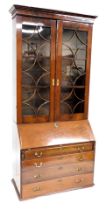 A George III mahogany bureau bookcase, the associated top with two astragal glazed doors, the base w