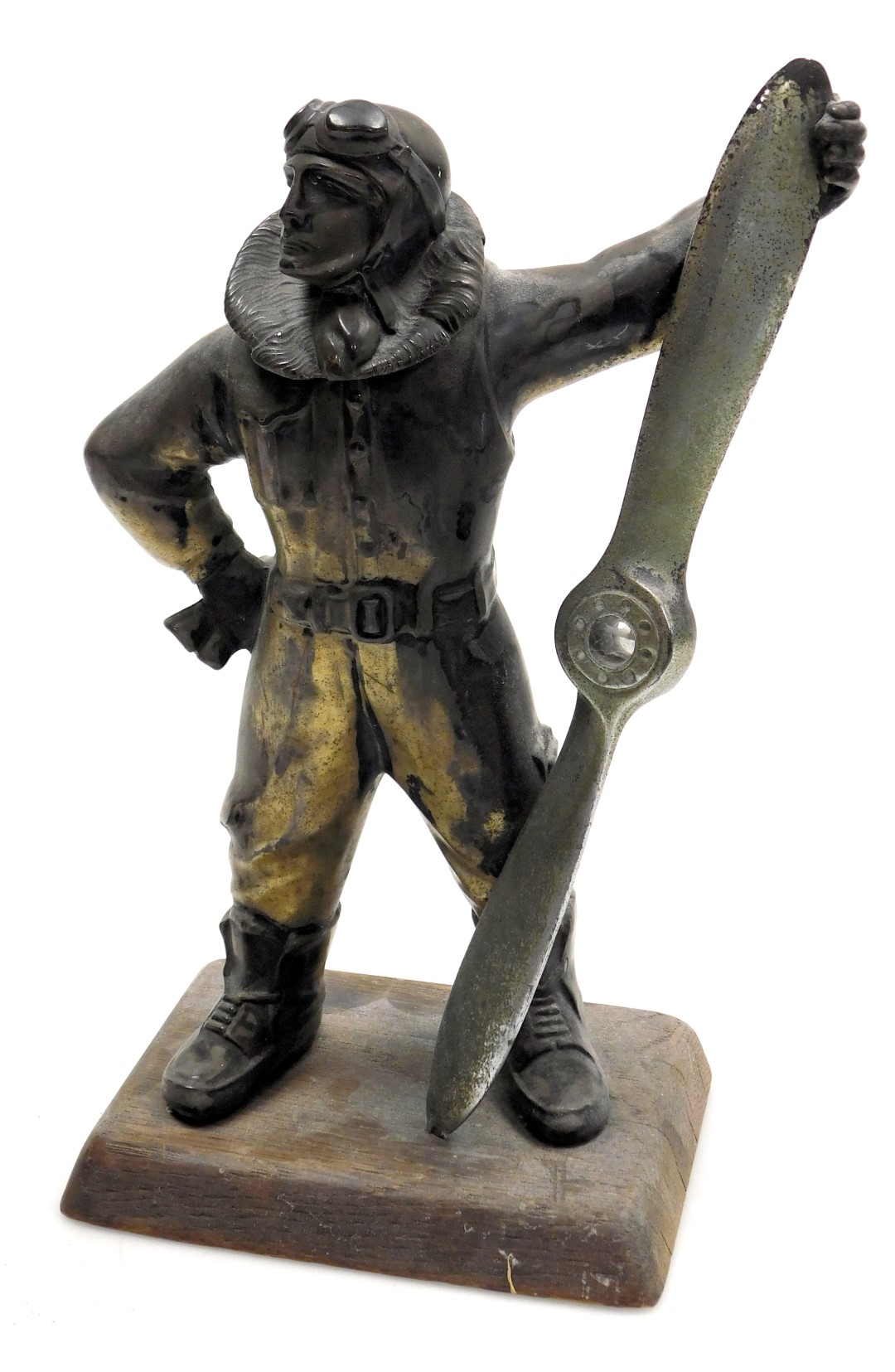 A 1930s silver plated aviator lighter, modelled as a pilot holding a propeller, on an oak base, 27cm