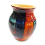 A Poole Pottery Galaxy vase, decorated in tones of blue, orange and red, raised marks, 20.5cm high.