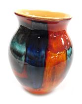 A Poole Pottery Galaxy vase, decorated in tones of blue, orange and red, raised marks, 20.5cm high.