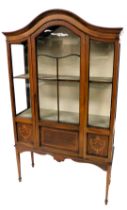 An Edwardian mahogany marquetry and chequer banded display cabinet, with an arched top over a glazed