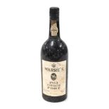 A bottle of Warre's 1963 vintage port, serial number SY418234.