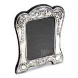 An Elizabeth II silver strut photograph frame, embossed with tied bows, swags and laurel wreaths, R