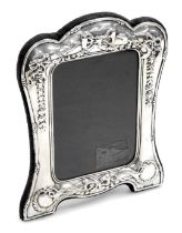 An Elizabeth II silver strut photograph frame, embossed with tied bows, swags and laurel wreaths, R