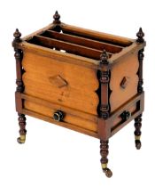 Victorian mahogany Canterbury, with three divisions, turned finials, above false drawers to each sid