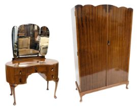 A mahogany two part bedroom suite, comprising wardrobe with shaped doors and cabriole legs 117cm wid