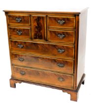 A mahogany and satinwood cross banded television cabinet, formed as a chest of drawers, the rectangu