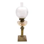 An early 20thC Messenger's number one brass oil lamp, of column form, with a fluted pressed glass re