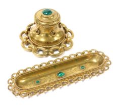 A Victorian brass desk set, inset with malachite cabochons, engraved with foliate decoration, and a