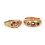 A Victorian 9ct gold and paste set three stone dress ring, size M, 0.9g, and a gypsy ring, stones la