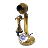A brass candlestick dial telephone, serial number 11331, 33cm high.