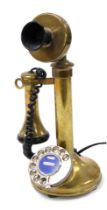A brass candlestick dial telephone, serial number 11331, 33cm high.