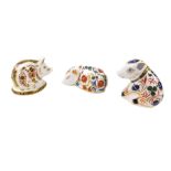 A Royal Crown Derby Imari paperweight, modelled as a sleeping pig, gold stopper, together with two f