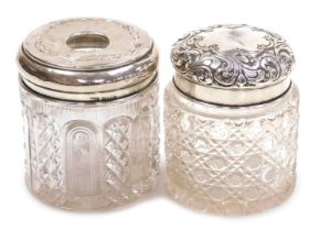 A Victorian cut glass and silver lidded dressing table jar, with embossed foliate decoration, centra