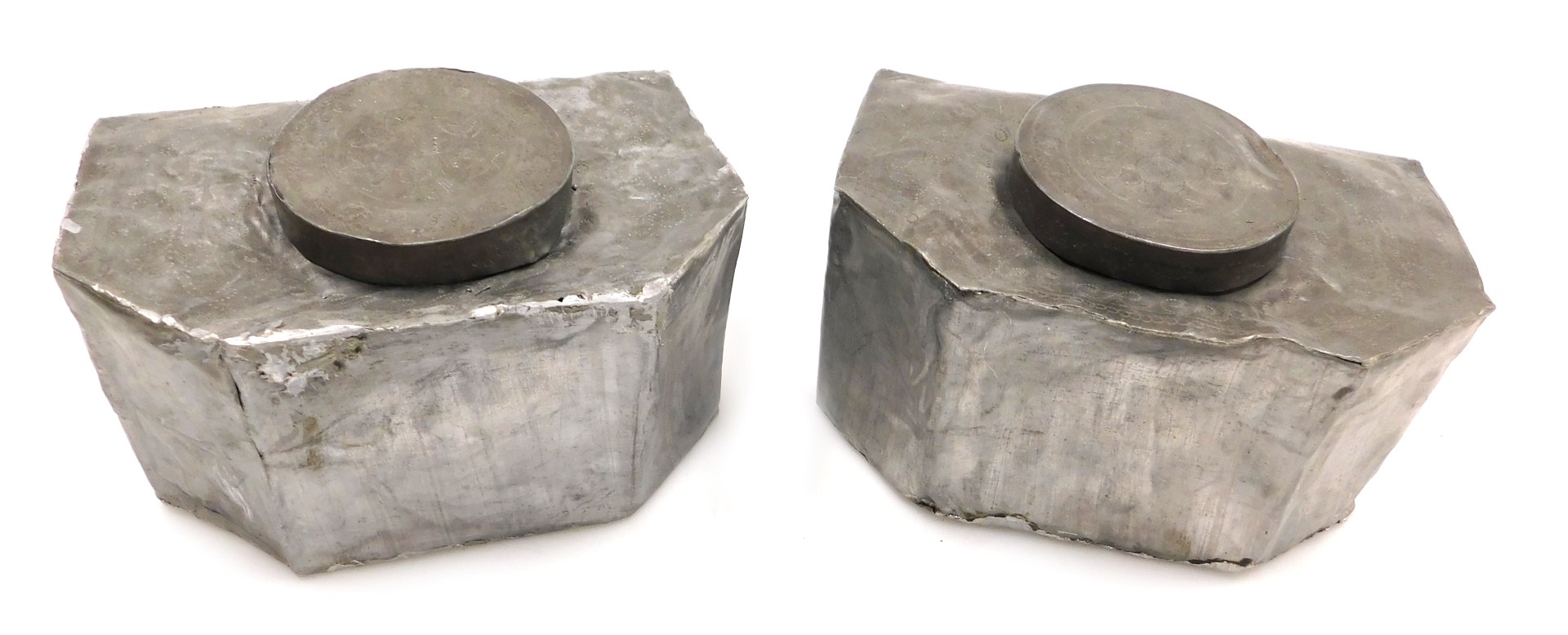A pair of early 20thC Chinese pewter tea caddies, of canted rectangular form, with engrave floral an