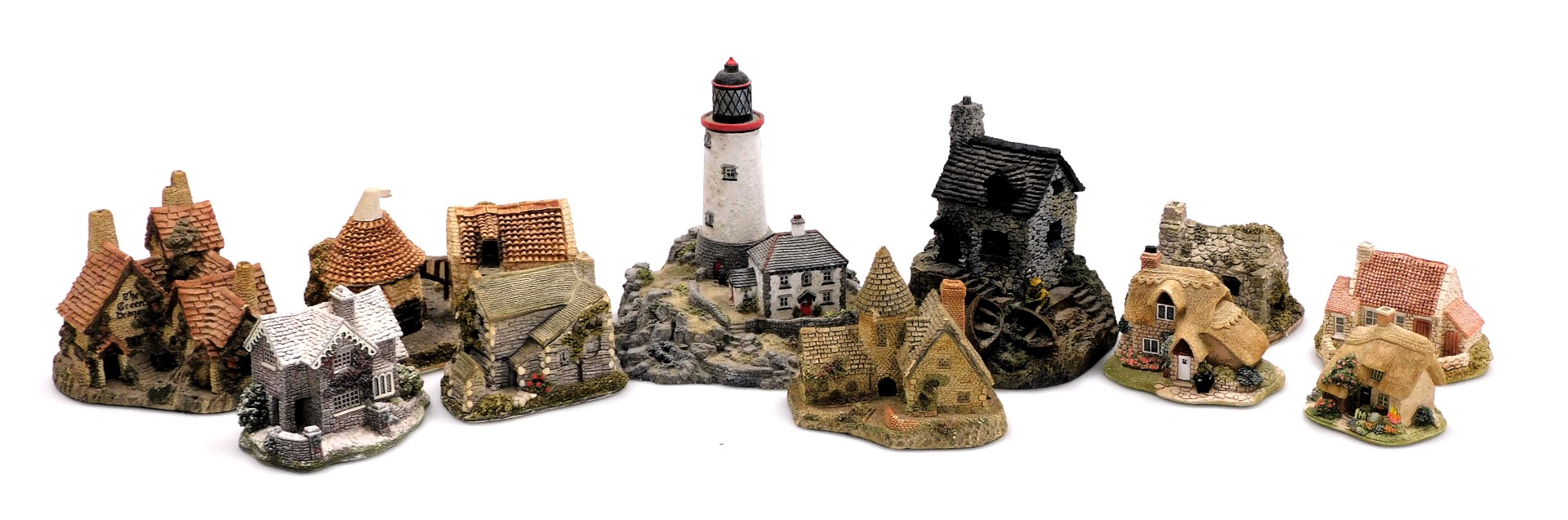A group of Lilliput Lane and Danbury Mint sculptures, including Green Dragon Pub, The Vicarage, Appl