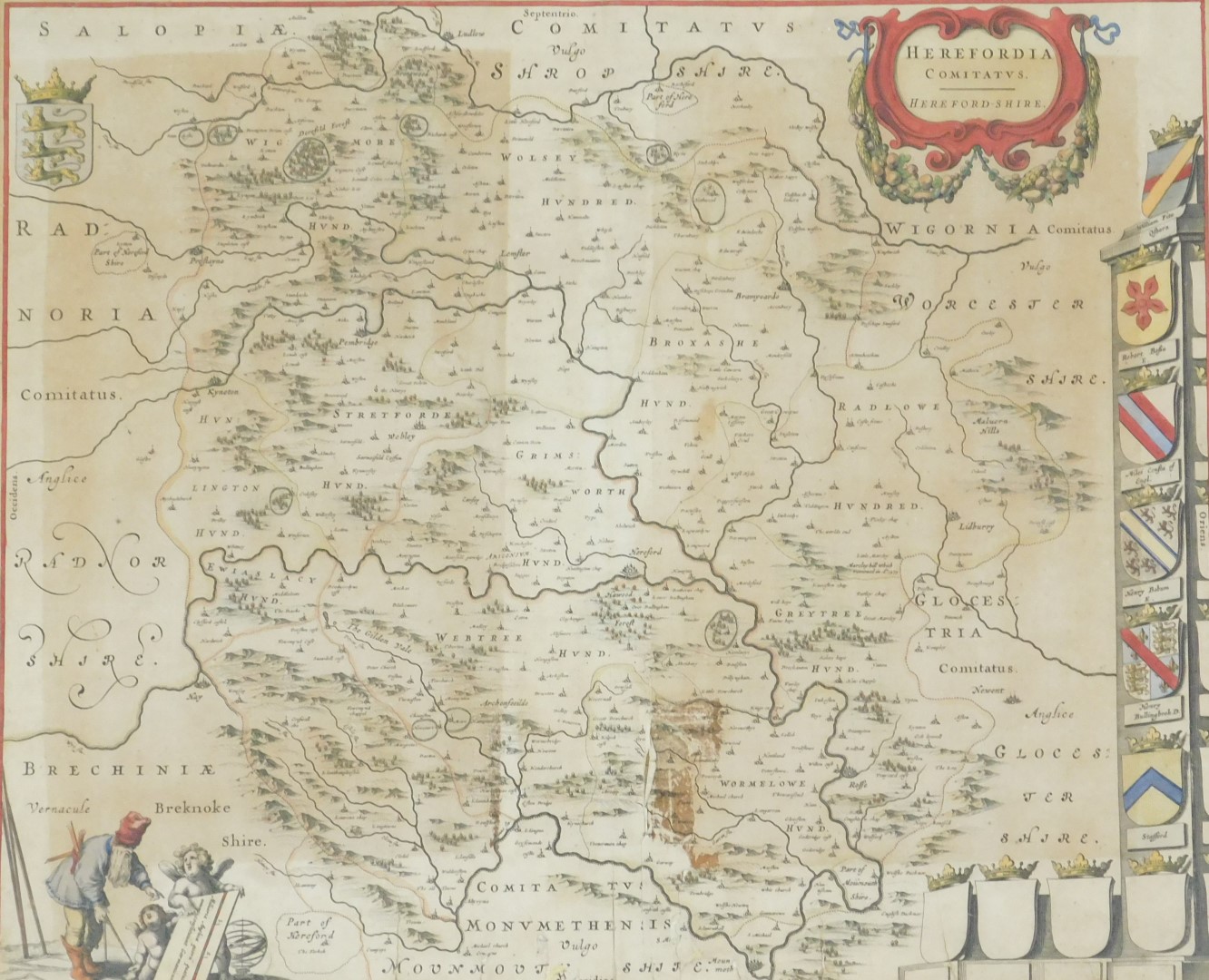 An 18thC map of Herefordshire, showing coats of arms, hand coloured engraving, 40cm x 48cm. (AF)