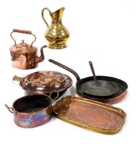 A group of 19thC and later copper ware, including a copper frying pan with cast iron handle, kettle,