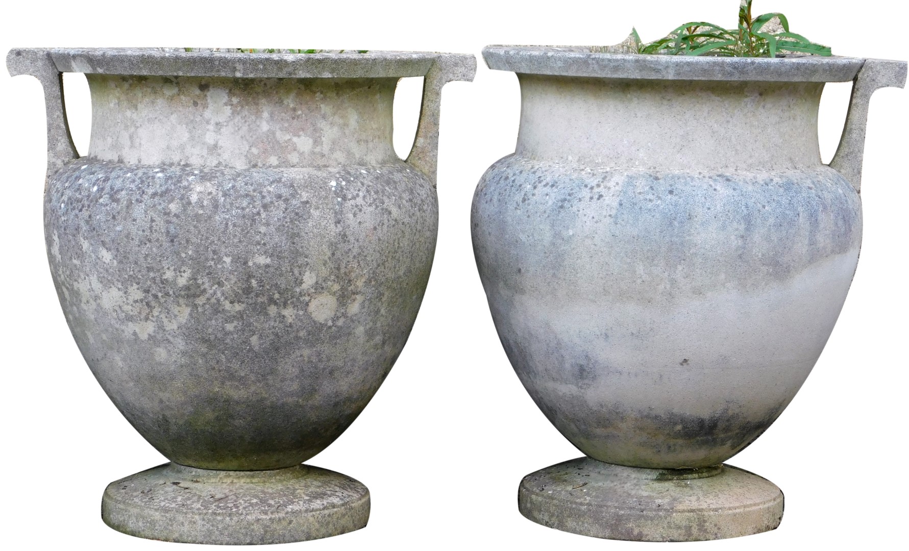 A pair of reconstituted stone two handled garden urns, of amphora style, on a circular plinth, 52cm