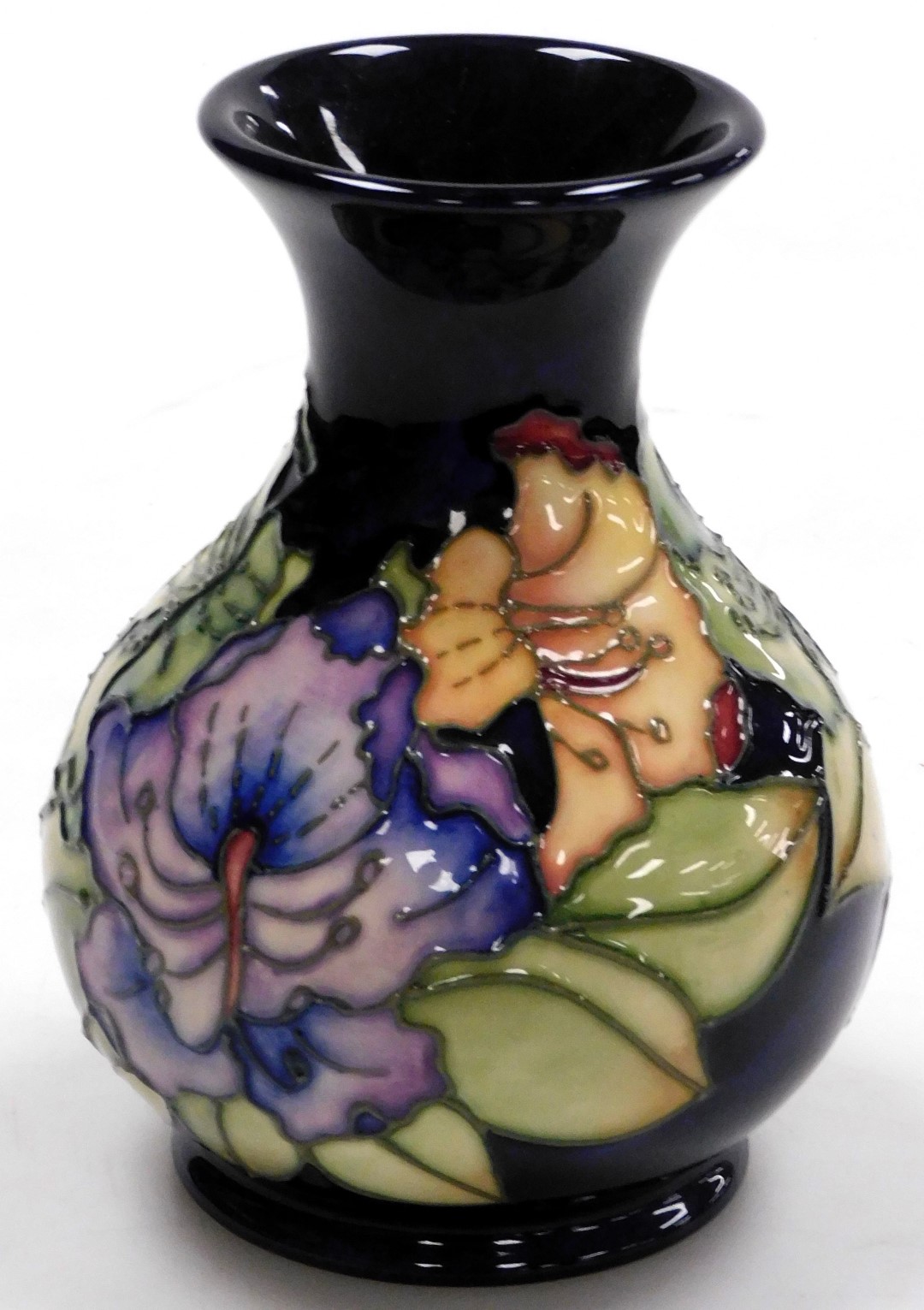 A Moorcroft pottery vase, circa 1996, decorated with flowers against a dark blue ground, impressed a - Image 2 of 3