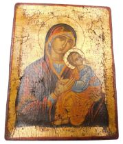 An Orthodox wooden icon, painted with the Madonna and child, 23.5cm x 18cm.