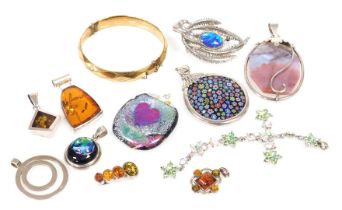 Silver and costume jewellery, including a millefiori pendant, four amber pendants and a gold plated