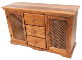 A hardwood sideboard, with an arrangement of three drawers flanked by two doors with slatted grills,