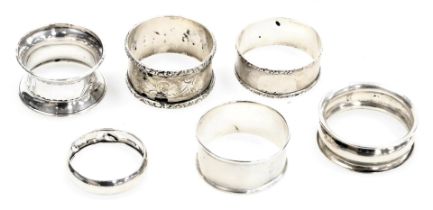 Six silver napkin rings, variously decorated, 2.37oz.