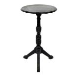 A Victorian ebonised Aesthetic movement occasional table, the circular top with a moulded edge, on a