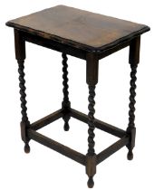An oak occasional table, the rectangular top with a shaped moulded edge, on spirally turned supports