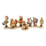 Eight Hummel pottery figures, comprising Doll Mother, School Girl, Happy Traveller, Little Gardener,